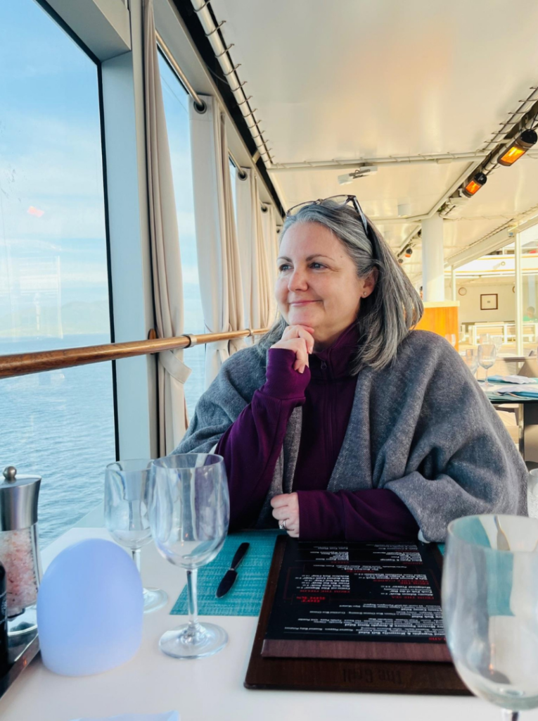 Michele dining al fresco on Silver Muse Alaska in June 2024.