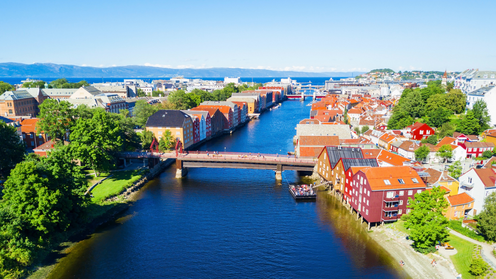 The Old Town Bridge, also called Gamle Bybro, crosses the Nidelva River to connect the city center with Bakklandet.