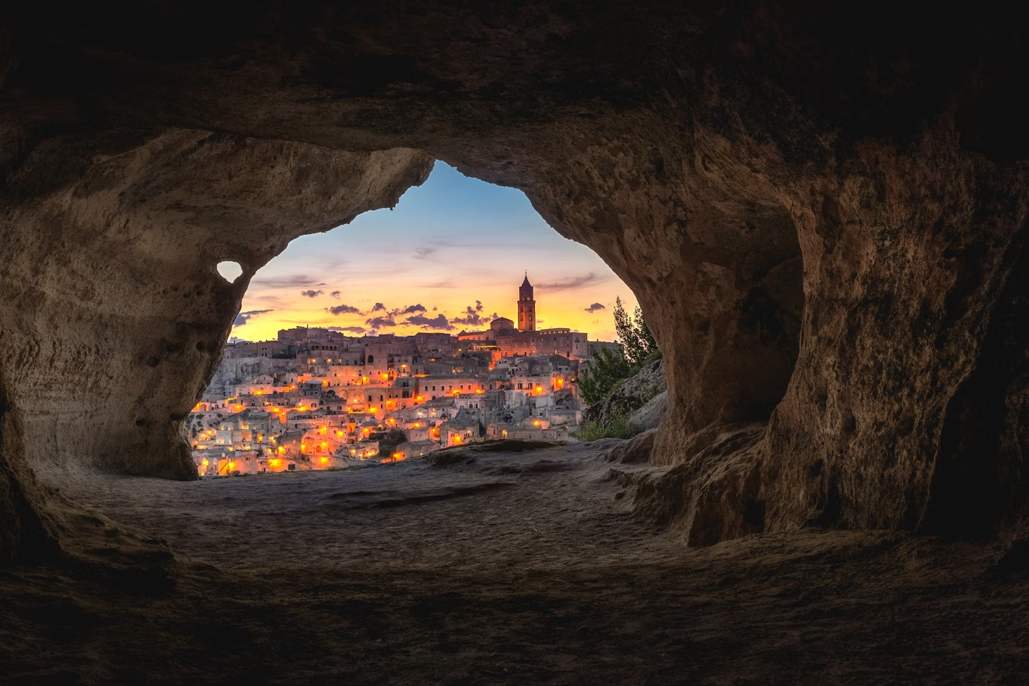 Sunset view of Matera from a Paleolithic cave in Sassi di Matera, Italy.